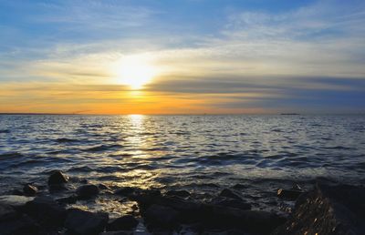 Scenic view of sea at sunset