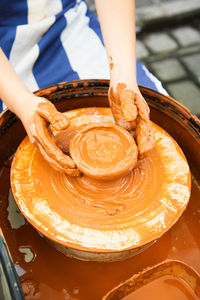 Midsection of man working at workshop