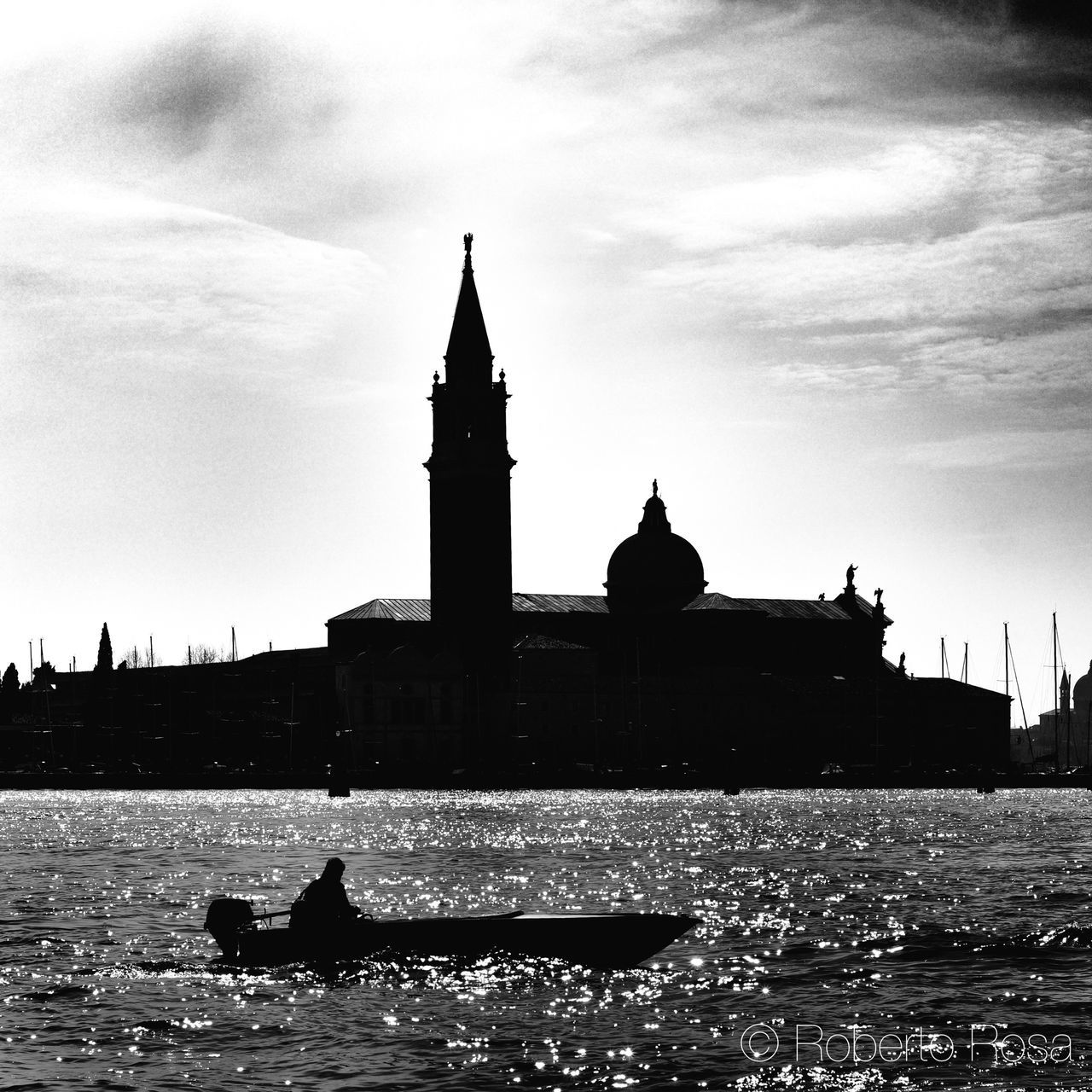 building exterior, architecture, water, built structure, waterfront, sky, place of worship, river, rippled, religion, church, transportation, silhouette, nautical vessel, travel destinations, travel, spirituality, famous place, animal themes