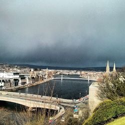 View of bridge against cloudy sky