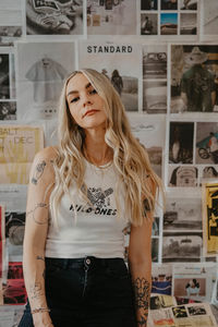 Portrait of young woman standing in store