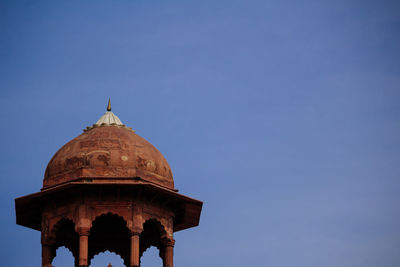 Low angle view of historic building against clear blue sky