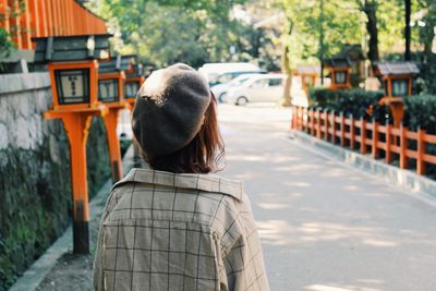 Rear view of man on railing