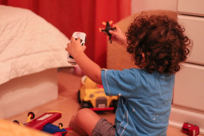 Girl playing with toy at home