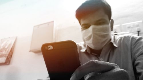 Photographer using mobile phone with mobile phone