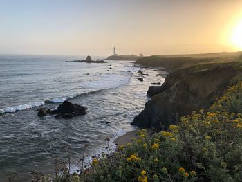 Scenic view of sea against clear sky during sunset