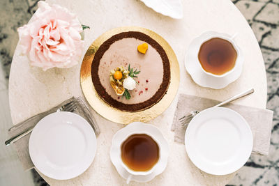 Top view of tea drinking with yummy cake without sugar