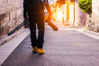 Full length of man walking on road