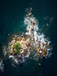 High angle view of rocks in sea