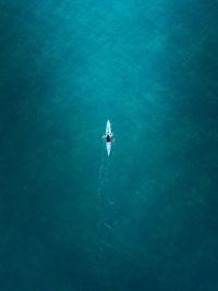 Aerial view of man kayaking in sea