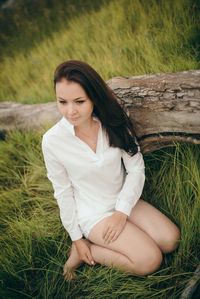 Young woman standing on field