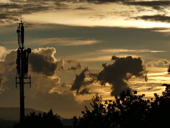 Low angle view of silhouette trees against sky during sunset