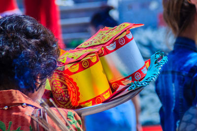 Rear view of women against blurred background