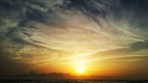 Scenic view of sea at sunset