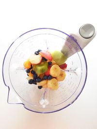 Close-up of fruit over white background