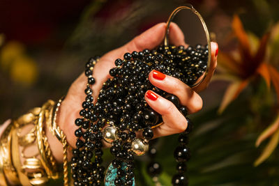 Close-up of woman hand holding butterfly