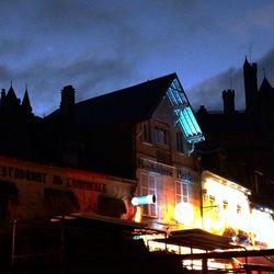 Buildings against sky at sunset