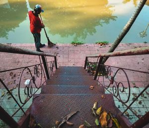 Full length of man standing by railing