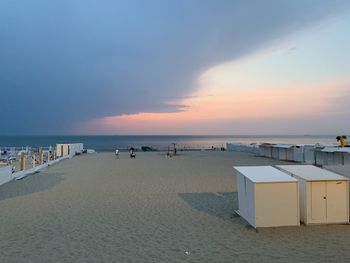 Scenic view of beach against sky during sunset