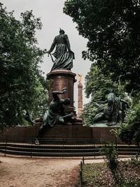 Low angle view of statue against sky