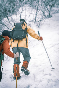 Man with umbrella on snow