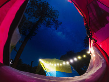 Low angle view of illuminated built structure at night