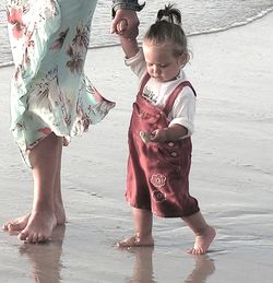 Woman jumping on shore