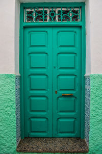 Closed blue door of house