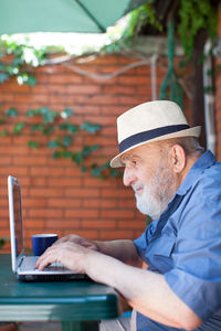 Portrait of man working on table