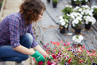 Woman working in greenhouse