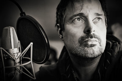 Close-up portrait of man wearing mask