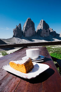 High angle view of food in plate on table against mountains