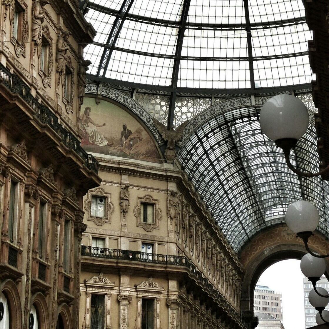 architecture, low angle view, built structure, building exterior, ceiling, indoors, arch, window, building, architectural feature, architectural column, history, famous place, ornate, day, city, travel destinations, no people, hanging, design