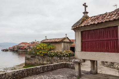 Exterior of houses and buildings against sky