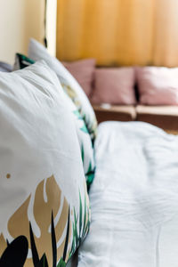 Close-up of white blanket on bed at home