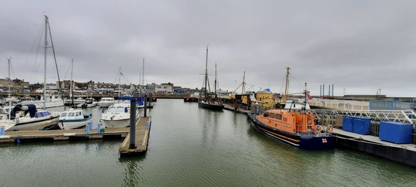 Boats moored at harbor