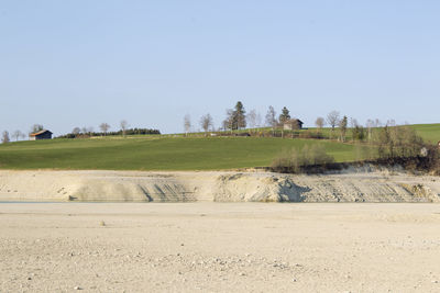 Scenic view of land against clear sky