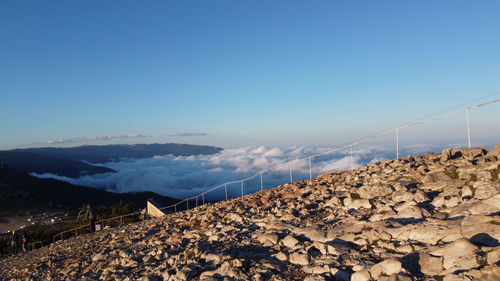 Scenic view of mountains against clear blue sky