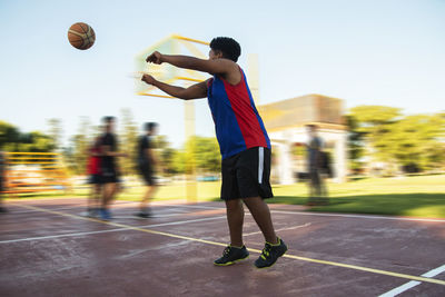 Young basketball player shooting