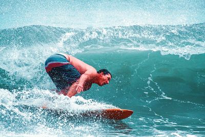 Man surfing in sea