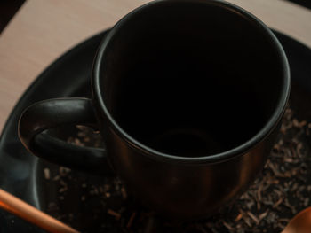 High angle view of coffee cup on table