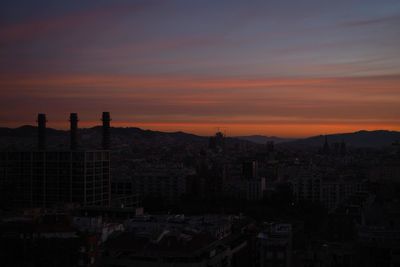 High angle view of buildings against sky during sunset