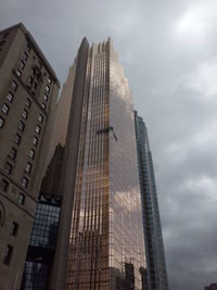 Low angle view of skyscrapers against sky