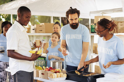 Portrait of senior man preparing food at home