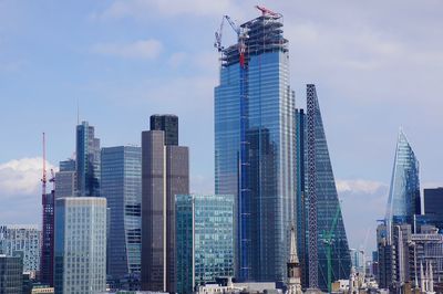 Modern buildings in city against sky