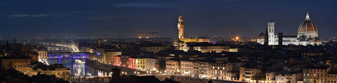 High angle view of city lit up at night
