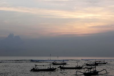 Scenic view of calm sea at sunset