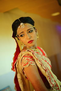 Young bride standing in corridor