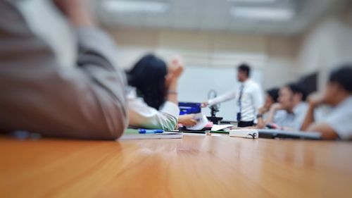 Businessman giving presentation to colleagues in office