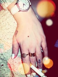 High angle view of woman hand with tattoo